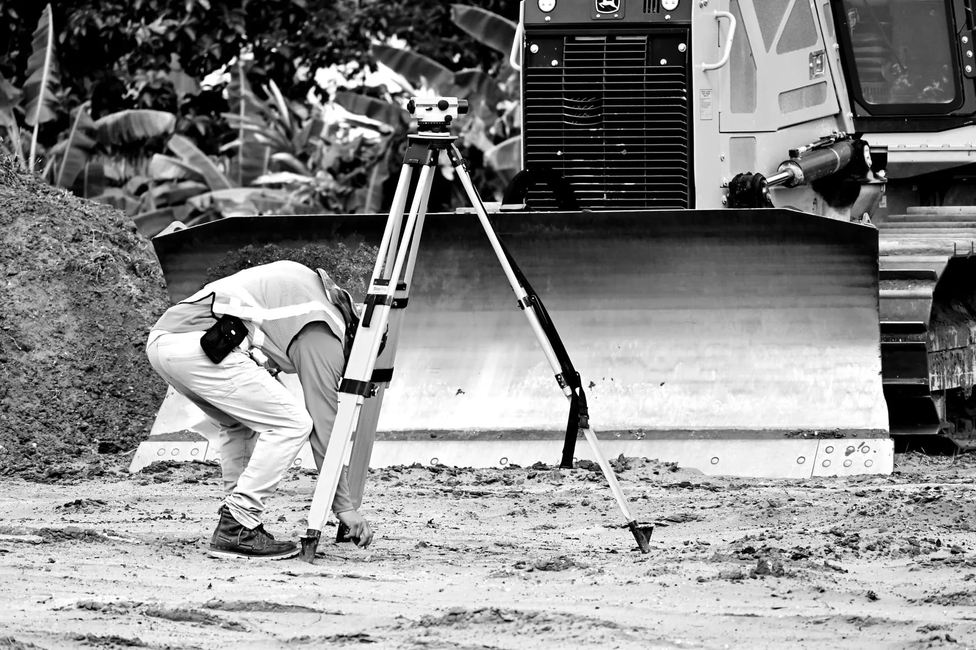 Land surveyor with theodolite on construction site — DEVSMARTS professional development services